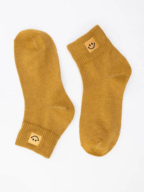 HAPPY FEET smiley-face socks
