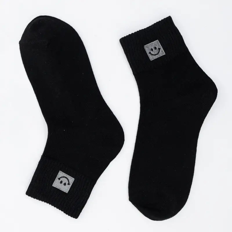 SNOWED IN smiley-face socks